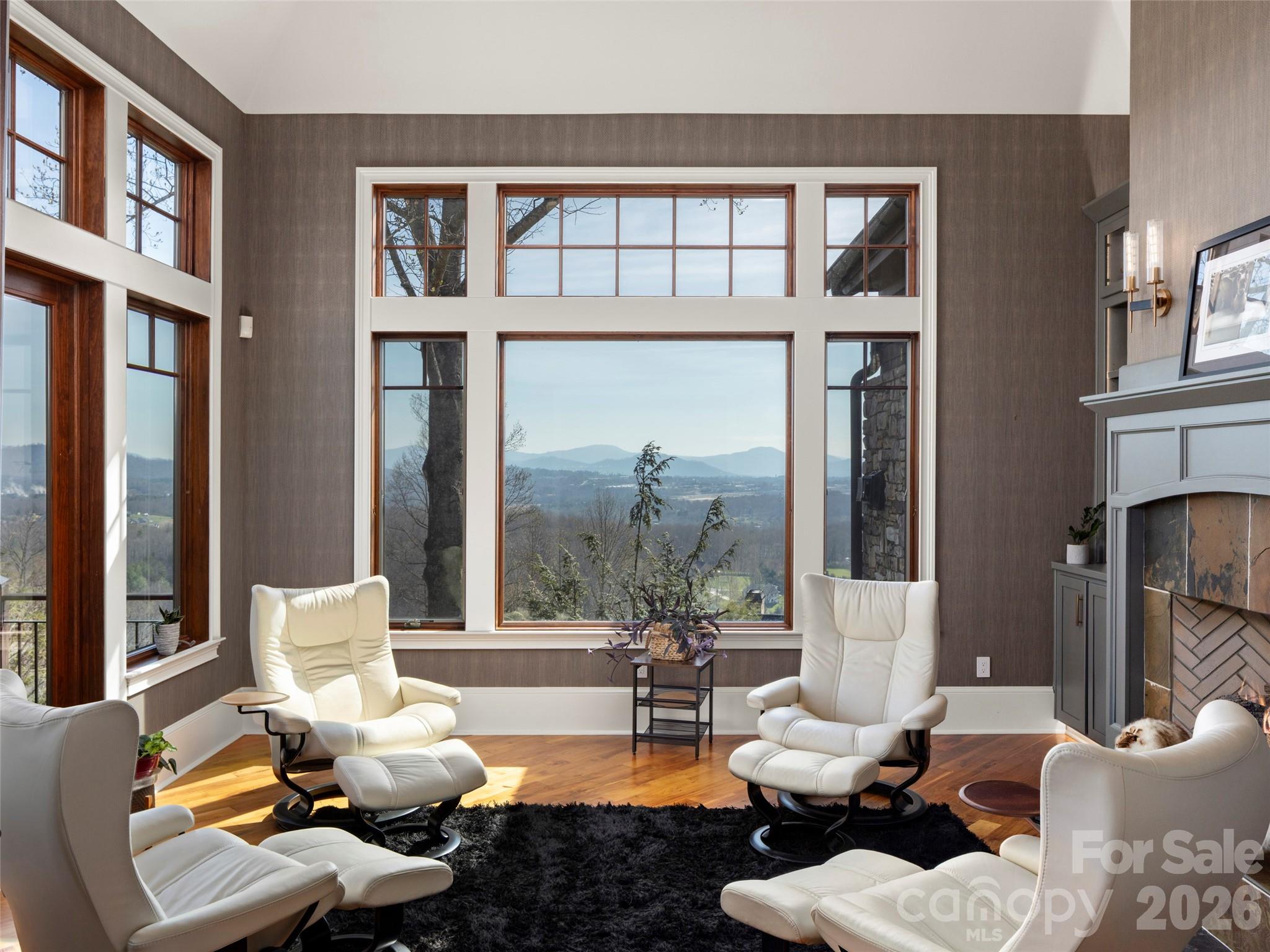 47 Ridge Pine Trail Arden, NC 28704 - Photo 14 of 48 a living room with furniture two large windows and a fireplace