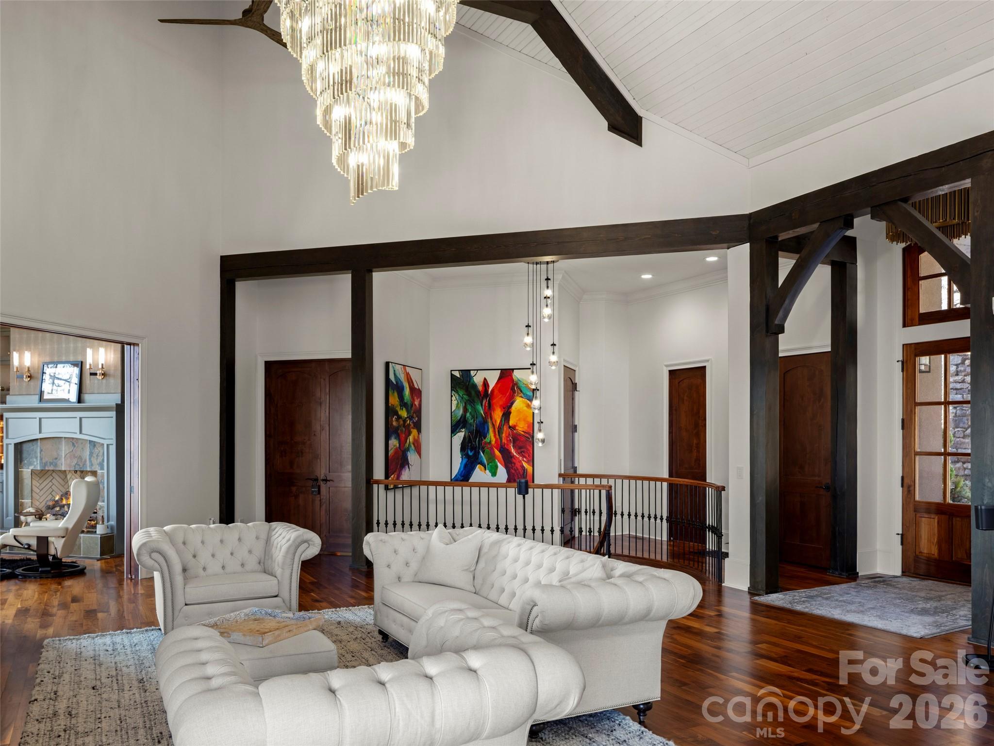 47 Ridge Pine Trail Arden, NC 28704 - Photo 18 of 48 a living room with furniture and a chandelier