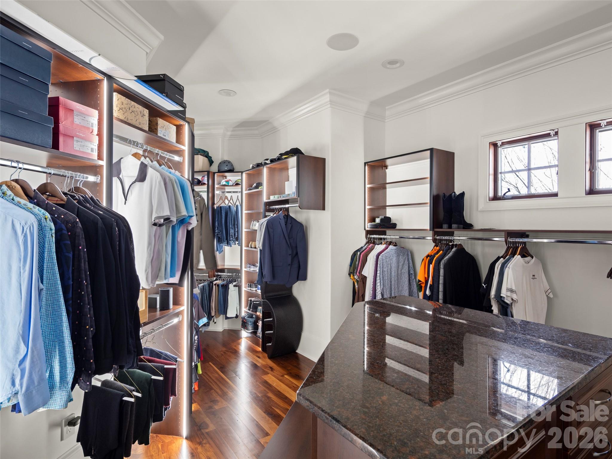 47 Ridge Pine Trail Arden, NC 28704 - Photo 40 of 48 a view of walk in closet with clothes and shoes