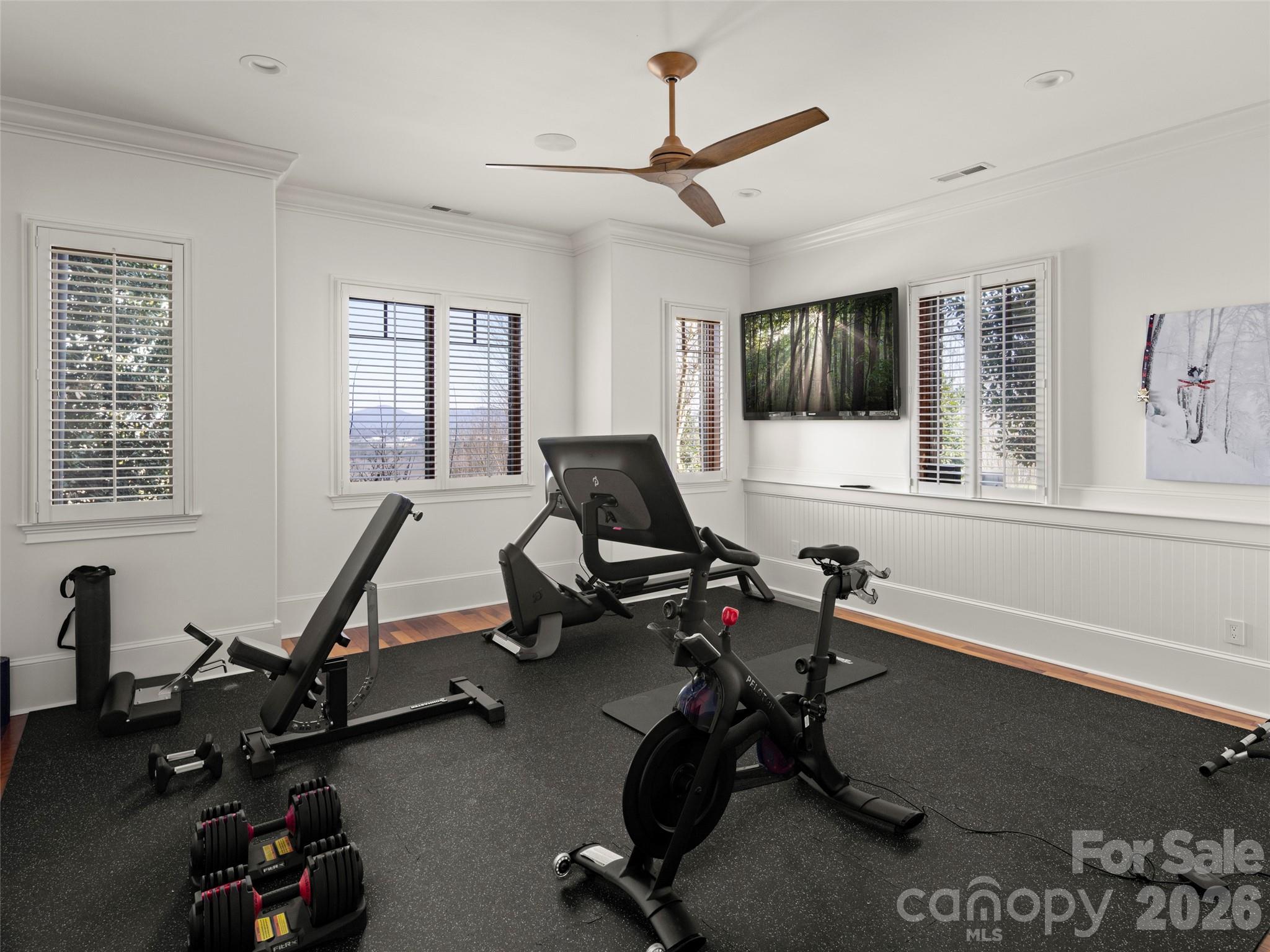 47 Ridge Pine Trail Arden, NC 28704 - Photo 44 of 48 a living room with furniture gym equipment and a large window