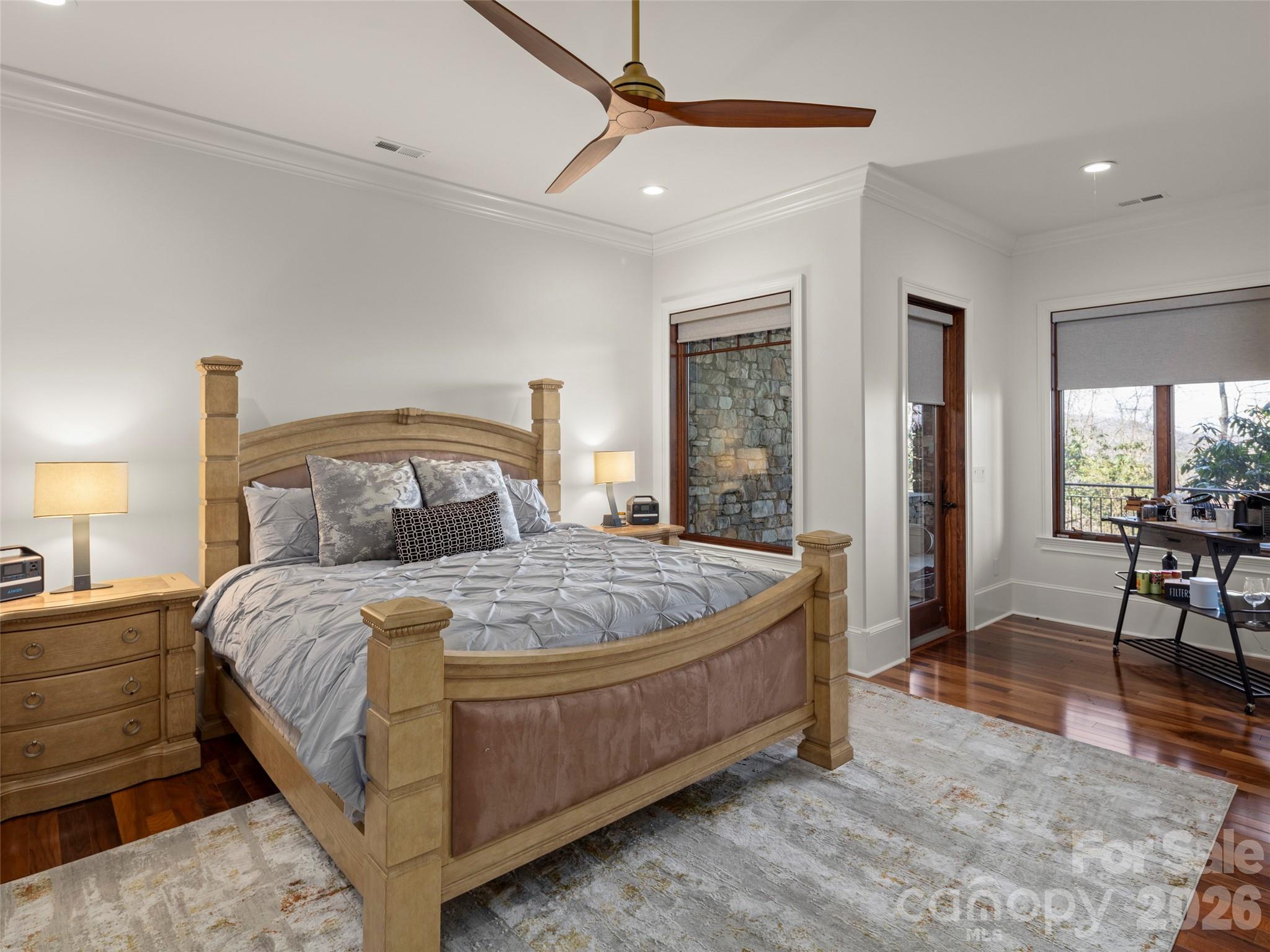 47 Ridge Pine Trail Arden, NC 28704 - Photo 46 of 48 a bedroom with a bed a table and chair