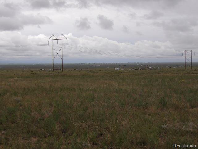 28 Ewing Ranch Sub Moffat, CO 81143 - Photo 6 of 7 a view of a lake with a big yard