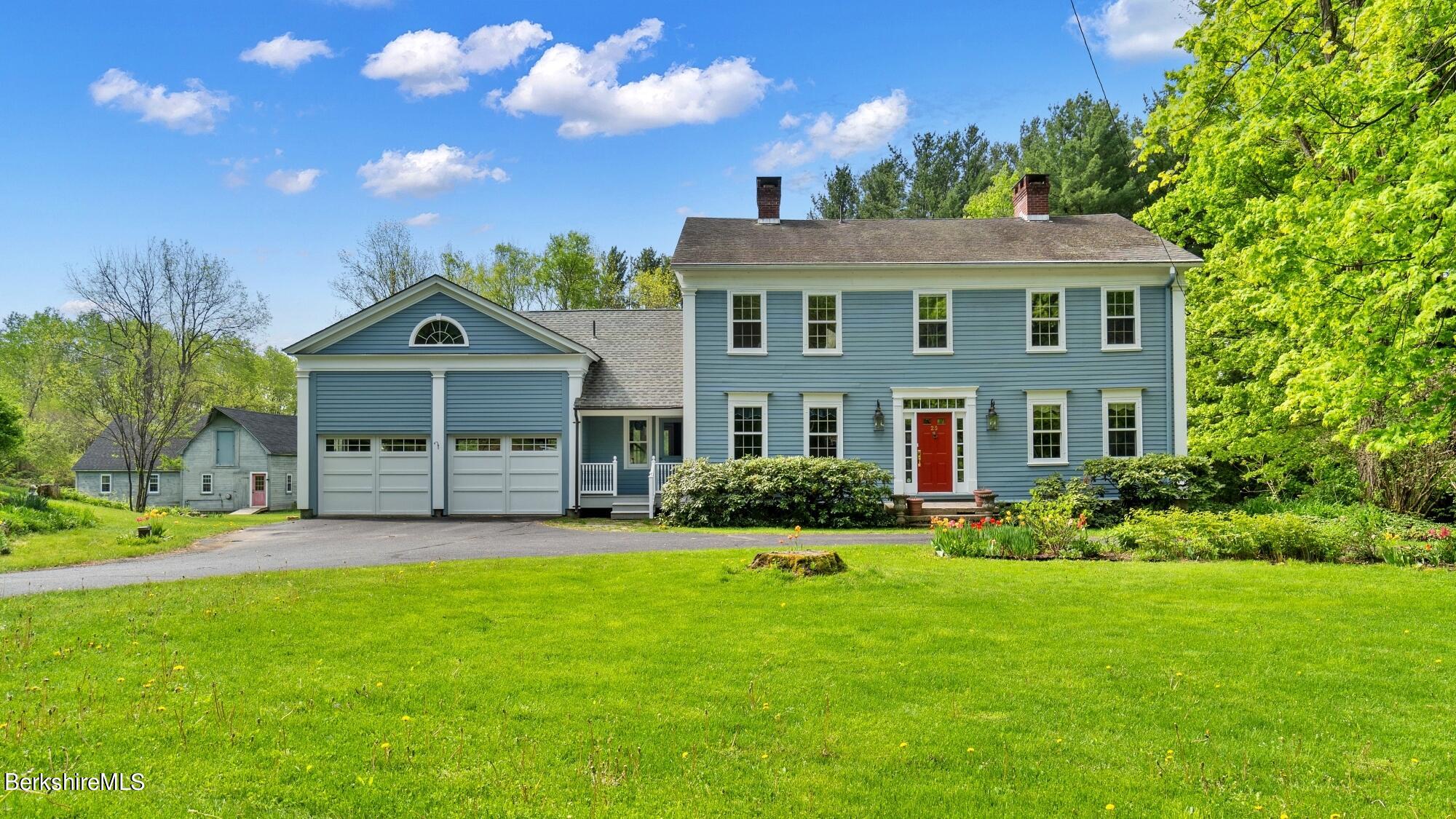 25 Cross Road West Stockbridge, MA 01266 - Photo 44 of 44 a front view of a house with a yard and garage