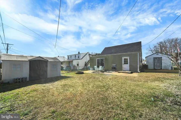a yellow house with a yard