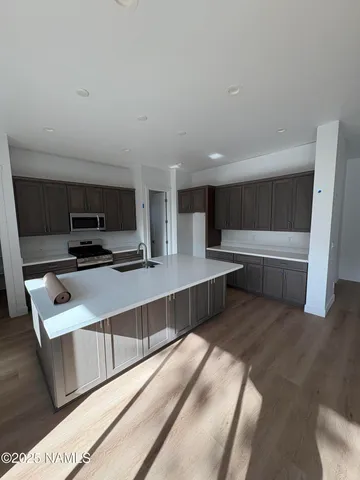 a large bathroom with a double vanity sink mirror and shower
