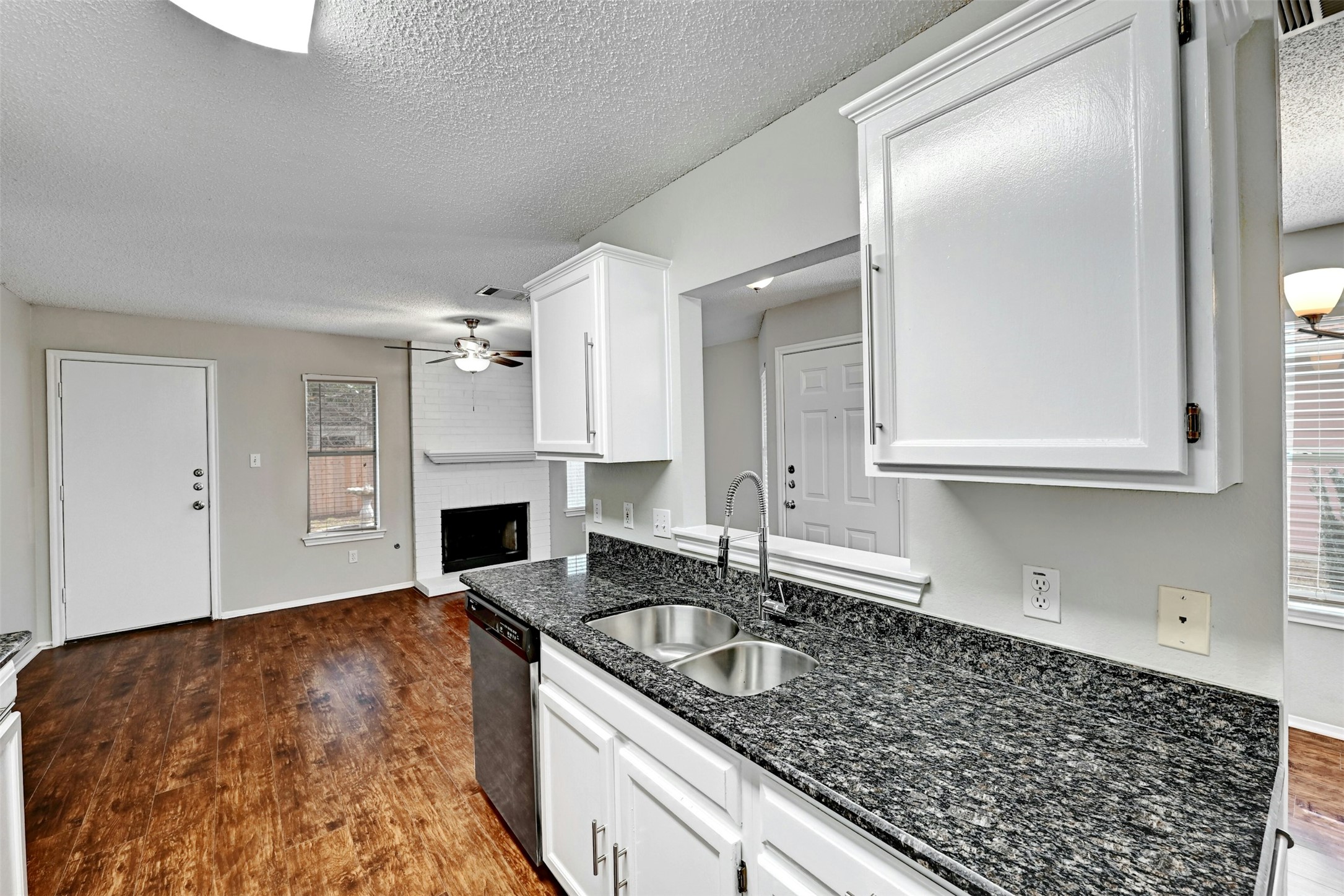 1807 Hollow Tree Boulevard Round Rock, TX 78681 - Photo 17 of 40 a kitchen with granite countertop a sink stainless steel appliances and cabinets