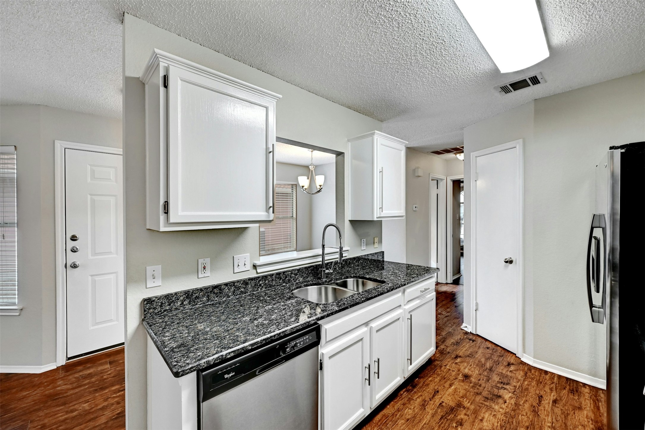 1807 Hollow Tree Boulevard Round Rock, TX 78681 - Photo 20 of 40 a kitchen with stainless steel appliances granite countertop a refrigerator stove and sink