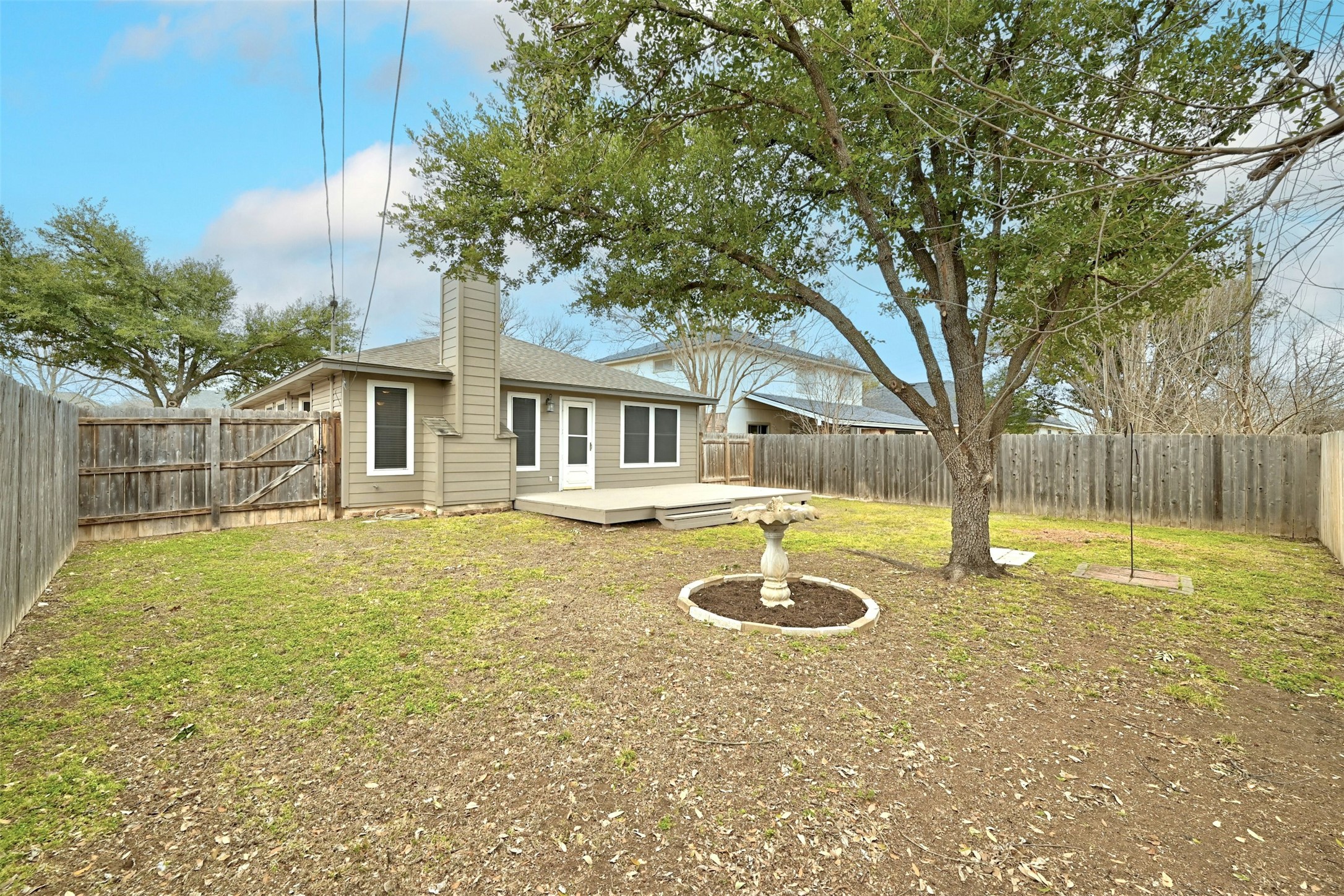 1807 Hollow Tree Boulevard Round Rock, TX 78681 - Photo 35 of 40 a swimming pool with wooden fence