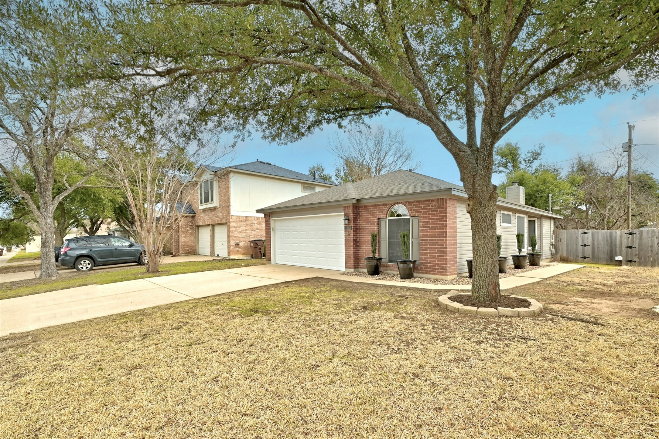 1807 Hollow Tree Boulevard Round Rock, TX 78681 - Photo 4 of 40 a front view of a house with a yard and garage