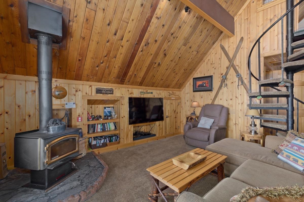 11000 Minaret Road, Unit 2 Mammoth Lakes, CA 93546 - Photo 11 of 31 a living room with furniture a flat screen tv and rug