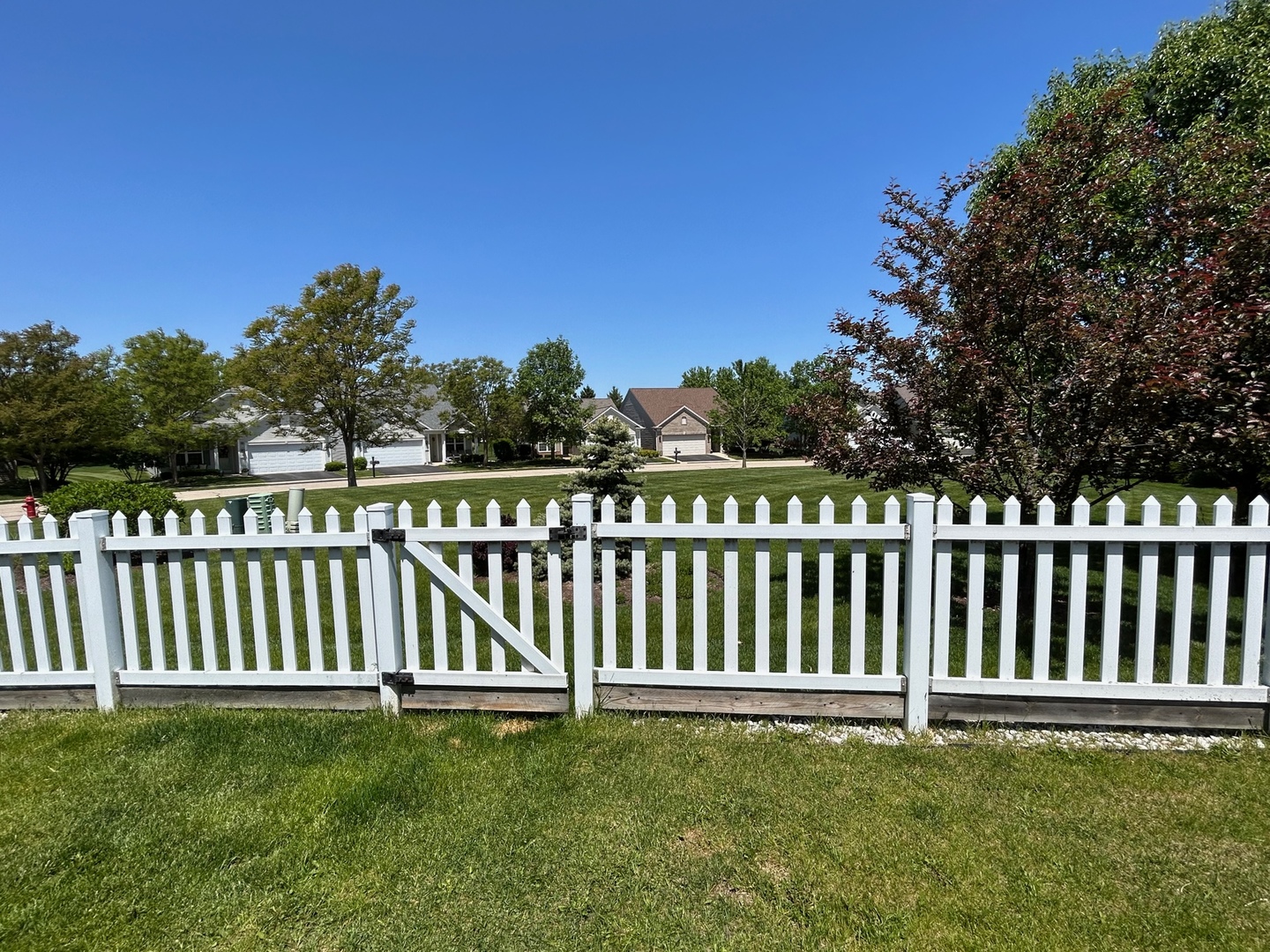 13792 Pineview Drive Huntley, IL 60142 - Photo 3 of 17 a view of a yard with a wooden fence