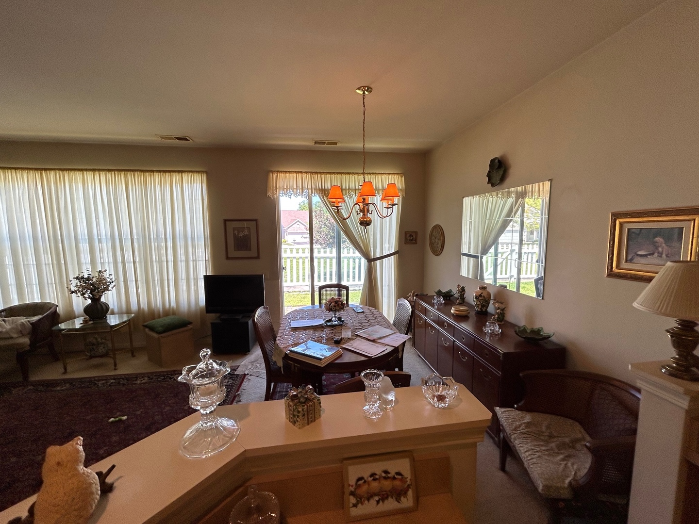 13792 Pineview Drive Huntley, IL 60142 - Photo 10 of 17 a living room with furniture and a chandelier
