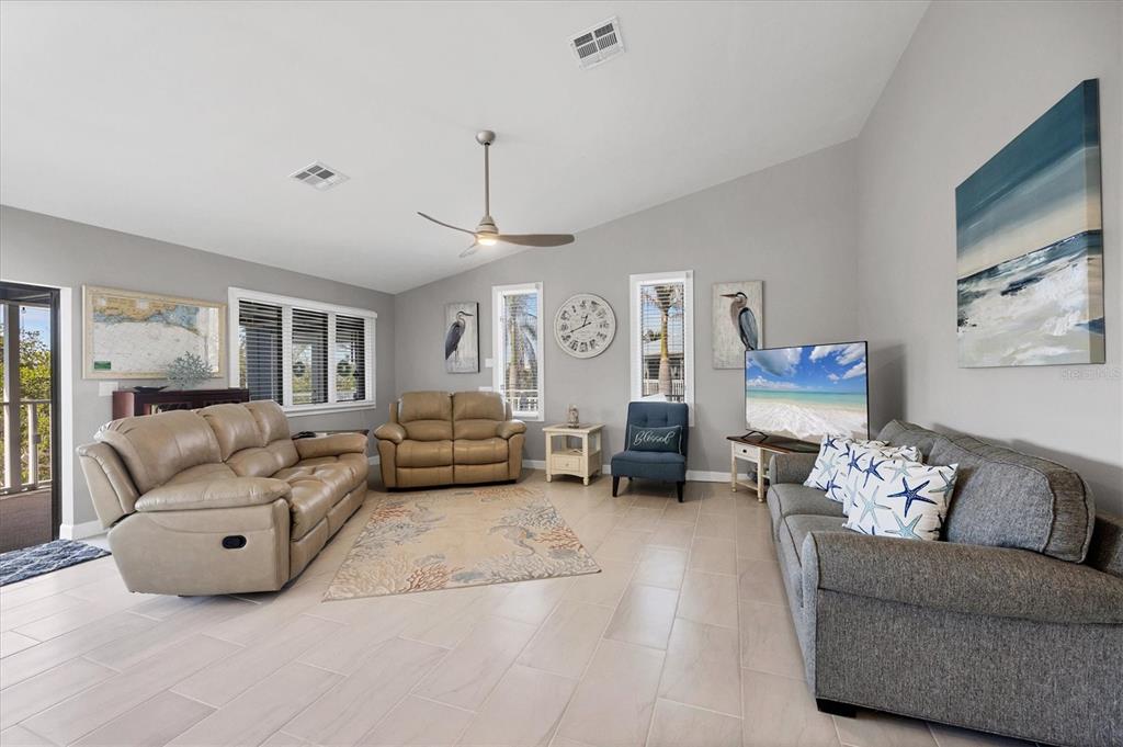 331 Bocilla Drive Boca Grande, FL 33921 - Photo 10 of 34 a living room with furniture and a chandelier