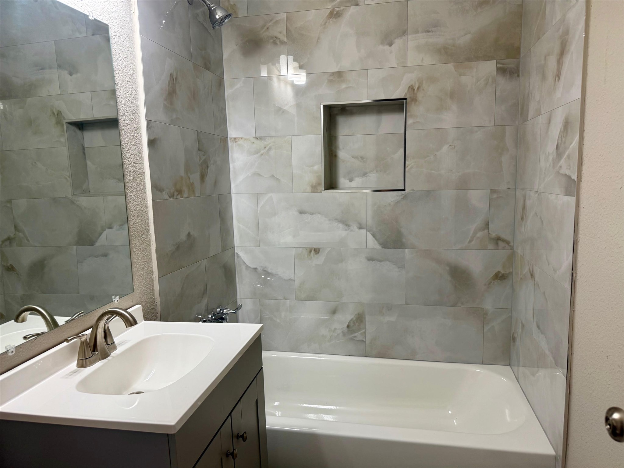 6743 Crestmont Street Houston, TX 77033 - Photo 4 of 11 a bathroom with a sink shower and bathtub