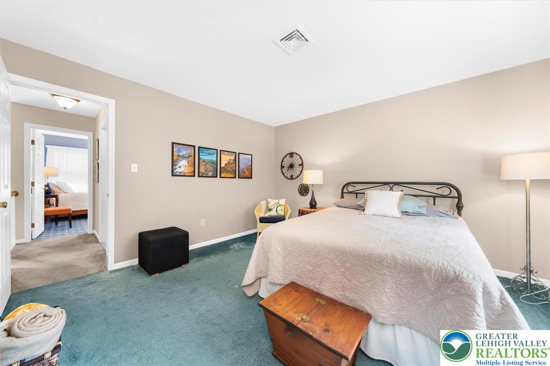 5616 Snowdrift Road Orefield, PA 18069 - Photo 18 of 36 Well-lit sleeping quarters with plush carpeting offers comfortable relaxation.