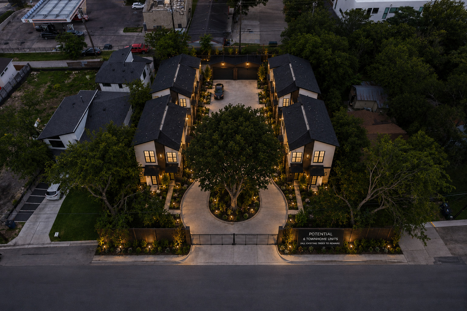 2017 East 8th Street Austin, TX 78702 - Photo 7 of 7 Illuminated townhomes with a grand gated entrance and mature trees create an inviting community.