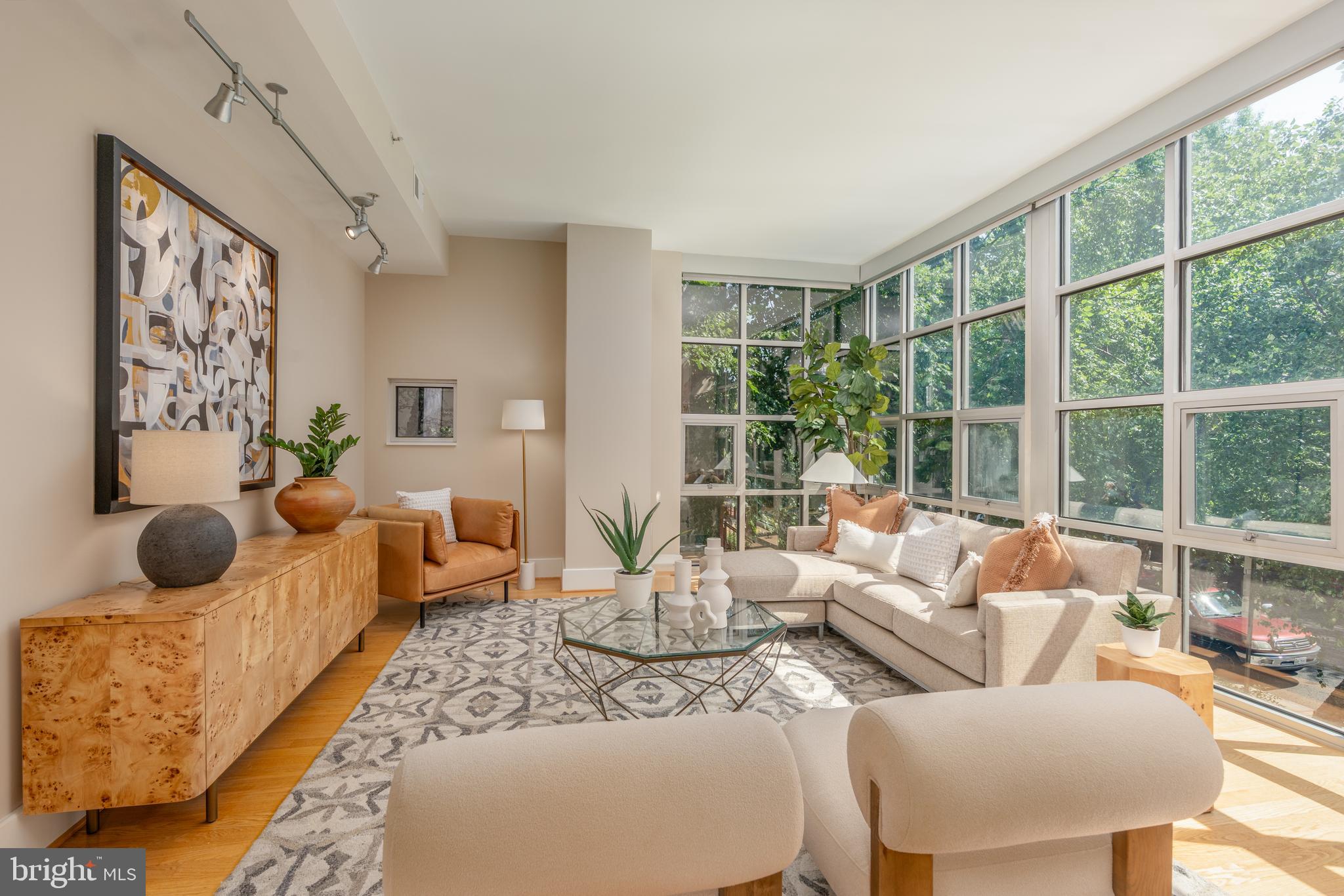 2100 11th Street Northwest, Unit 201 Washington, DC 20001 - Photo 12 of 38 a living room with furniture and a large window