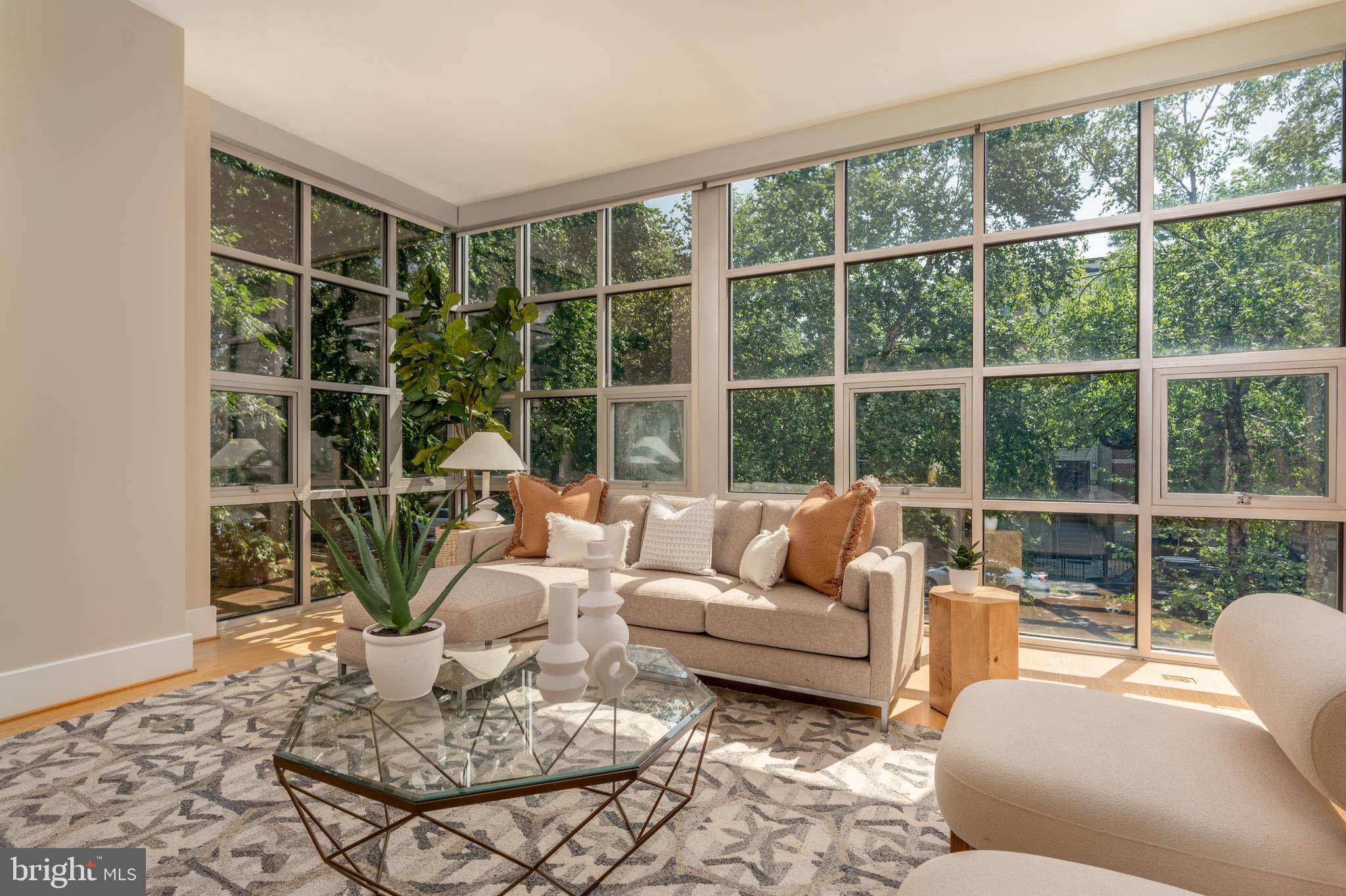 2100 11th Street Northwest, Unit 201 Washington, DC 20001 - Photo 16 of 38 a living room with furniture large window and table