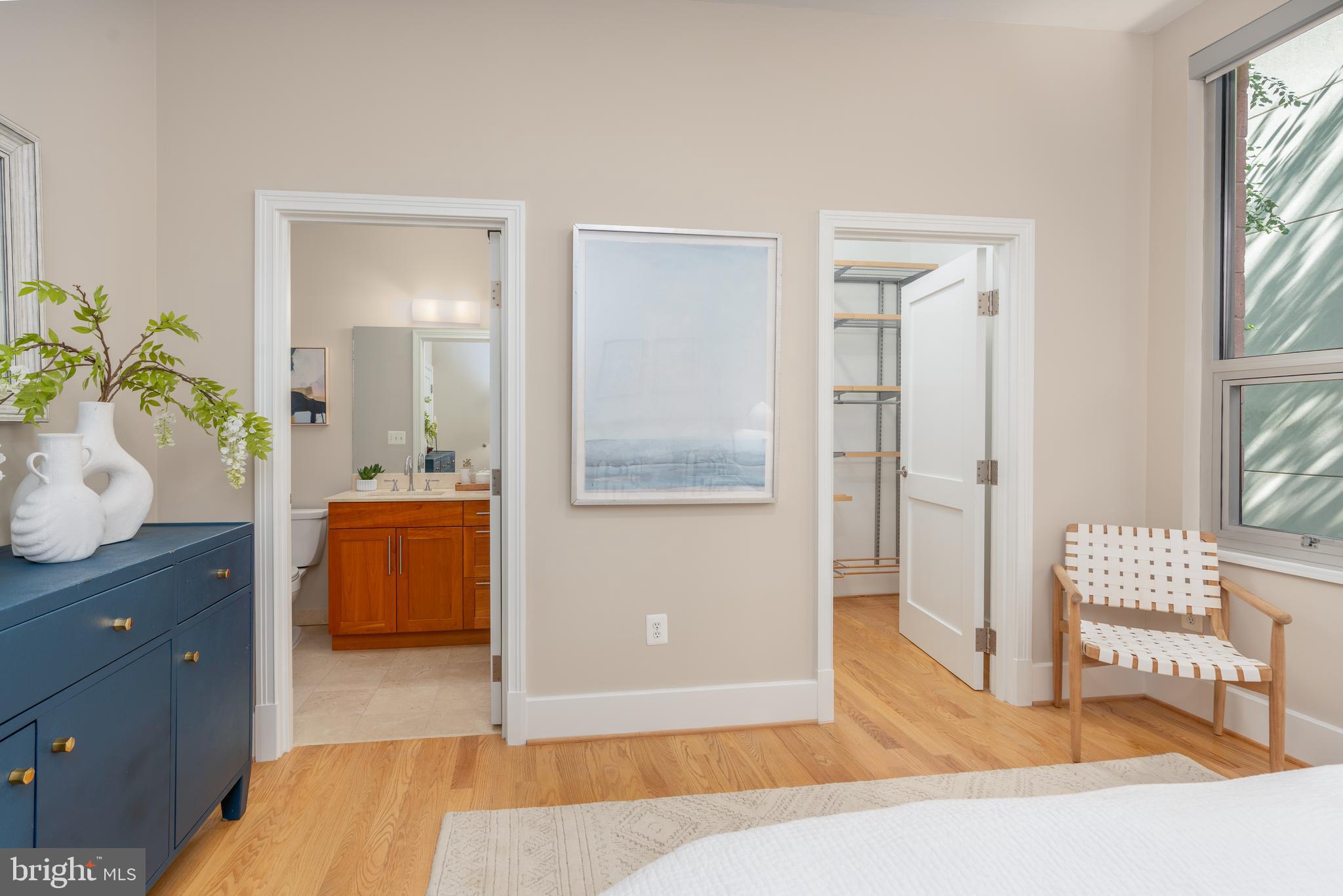 2100 11th Street Northwest, Unit 201 Washington, DC 20001 - Photo 25 of 38 a spacious bedroom with a bed and a dresser in it