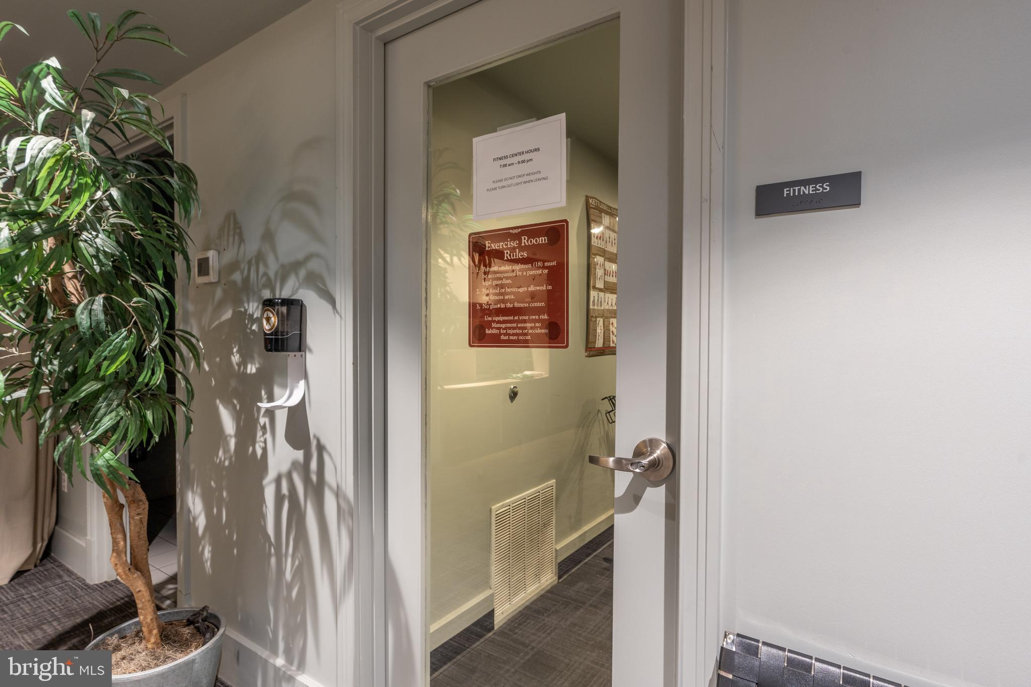 2100 11th Street Northwest, Unit 201 Washington, DC 20001 - Photo 31 of 38 a view of a bedroom from a hallway