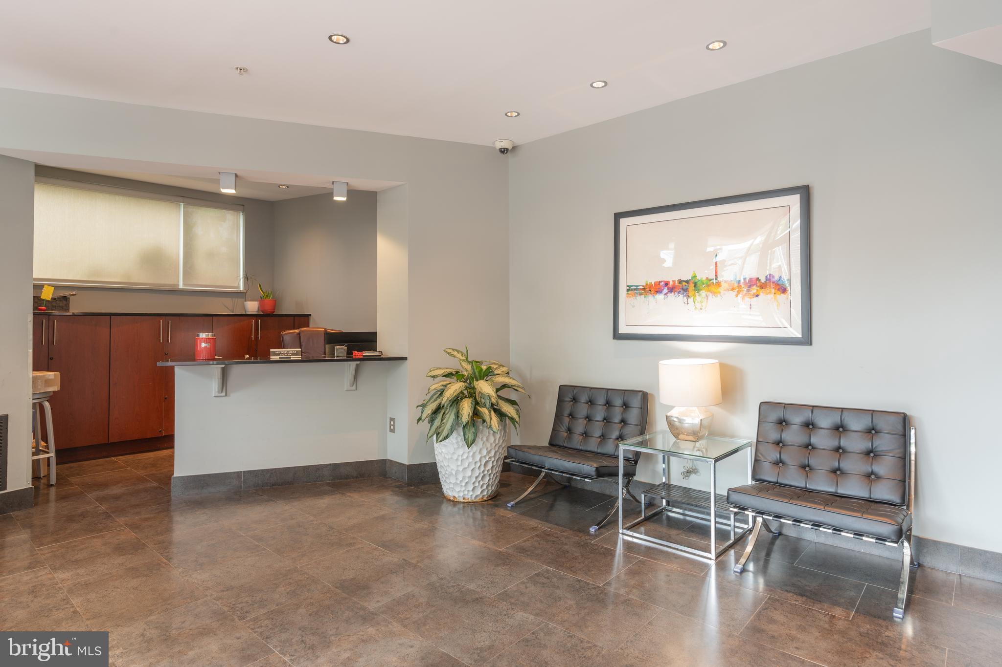 2100 11th Street Northwest, Unit 201 Washington, DC 20001 - Photo 4 of 38 a living room with furniture and a potted plant