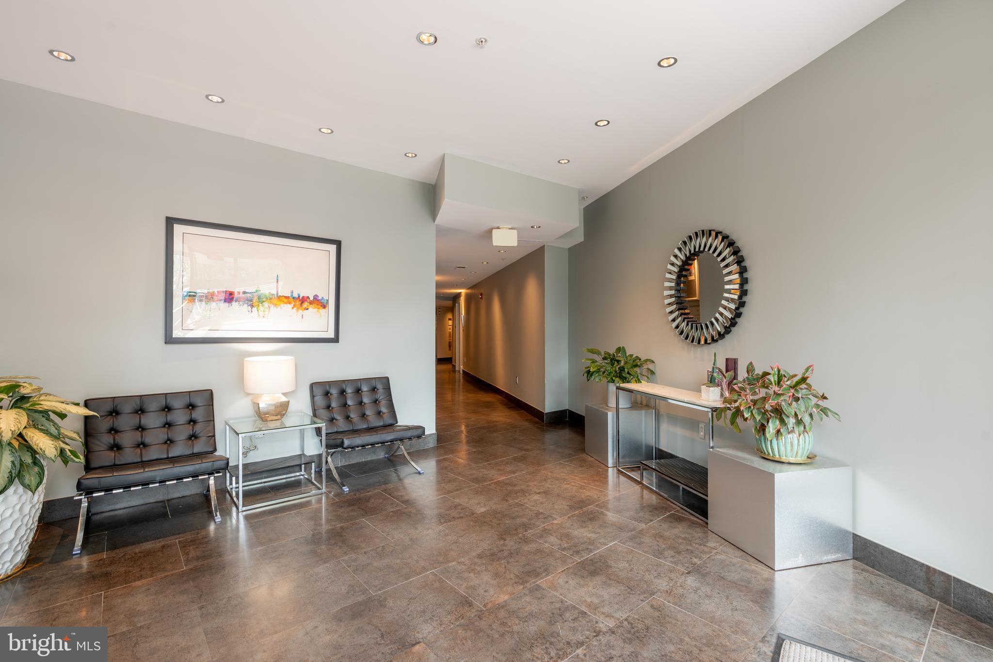 2100 11th Street Northwest, Unit 201 Washington, DC 20001 - Photo 5 of 38 a living room with furniture and a window