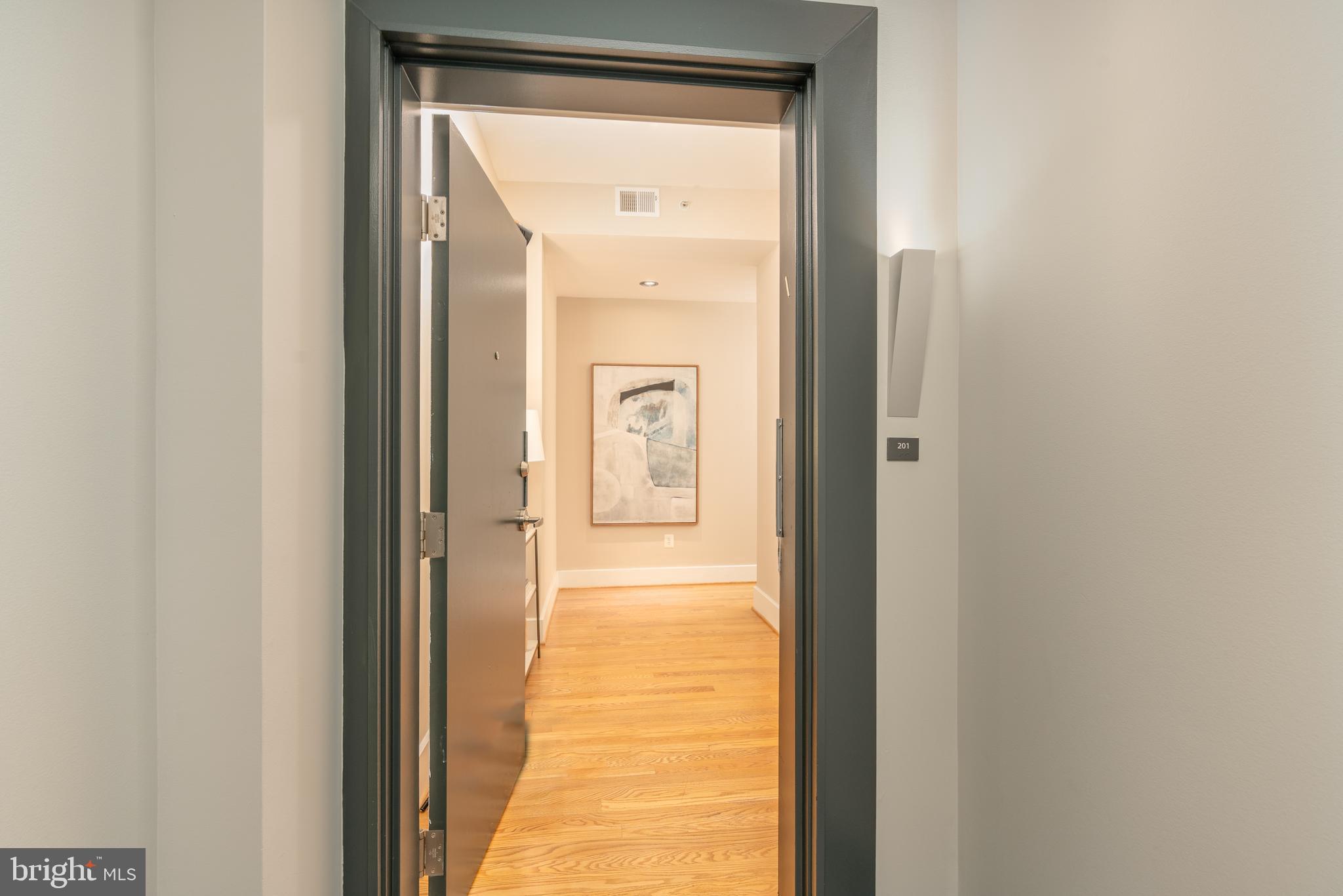 2100 11th Street Northwest, Unit 201 Washington, DC 20001 - Photo 6 of 38 a view of a bathroom from a hallway