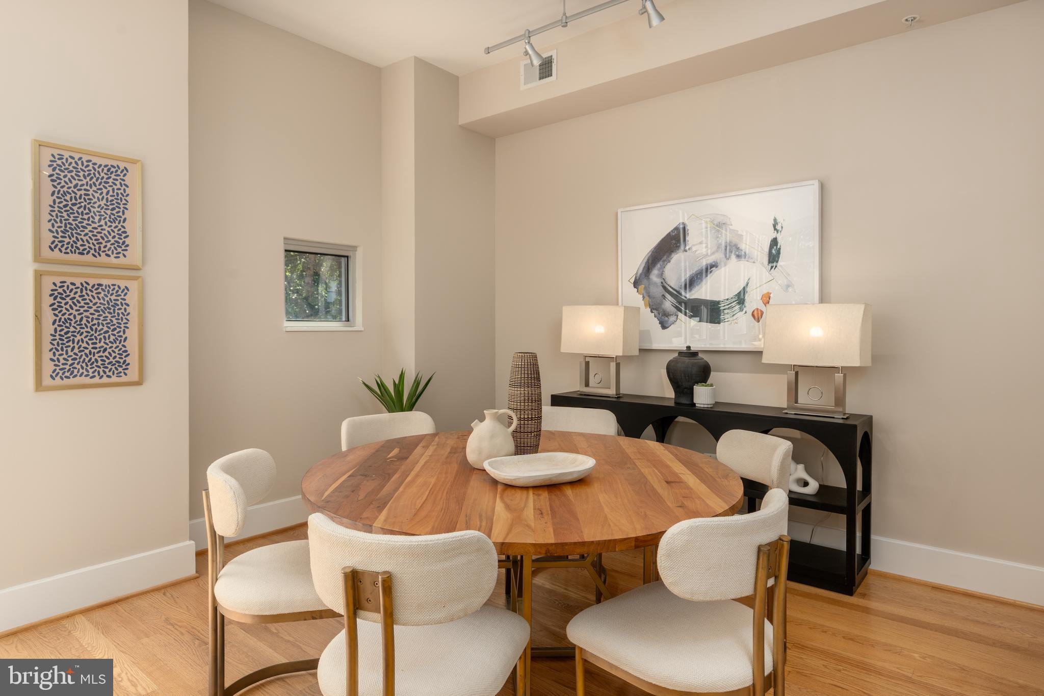 2100 11th Street Northwest, Unit 201 Washington, DC 20001 - Photo 10 of 38 a dining room with furniture and wooden floor