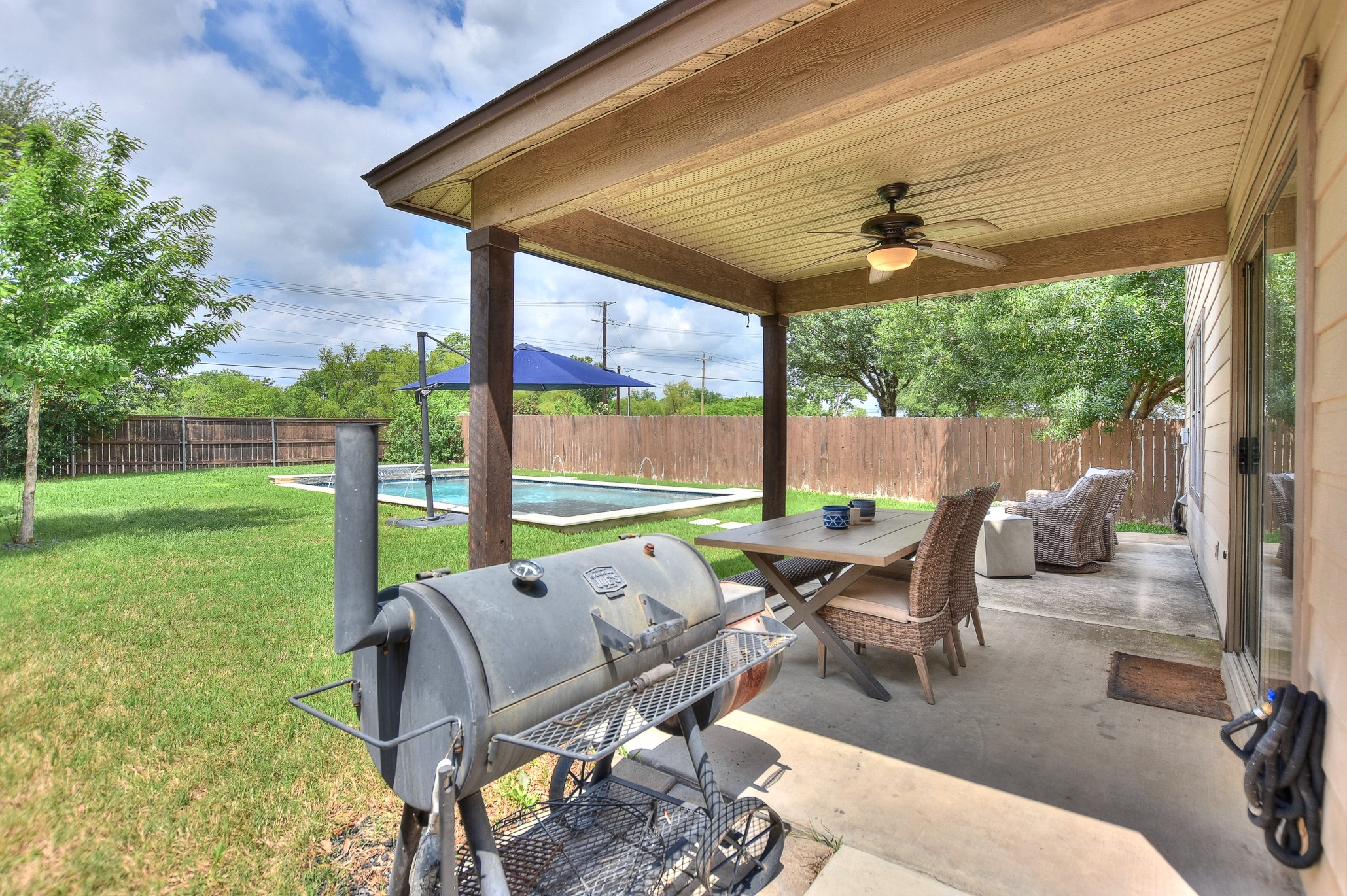 74 Jan Lane Georgetown, TX 78626 - Photo 9 of 31 a view of a patio with a table chairs and a backyard