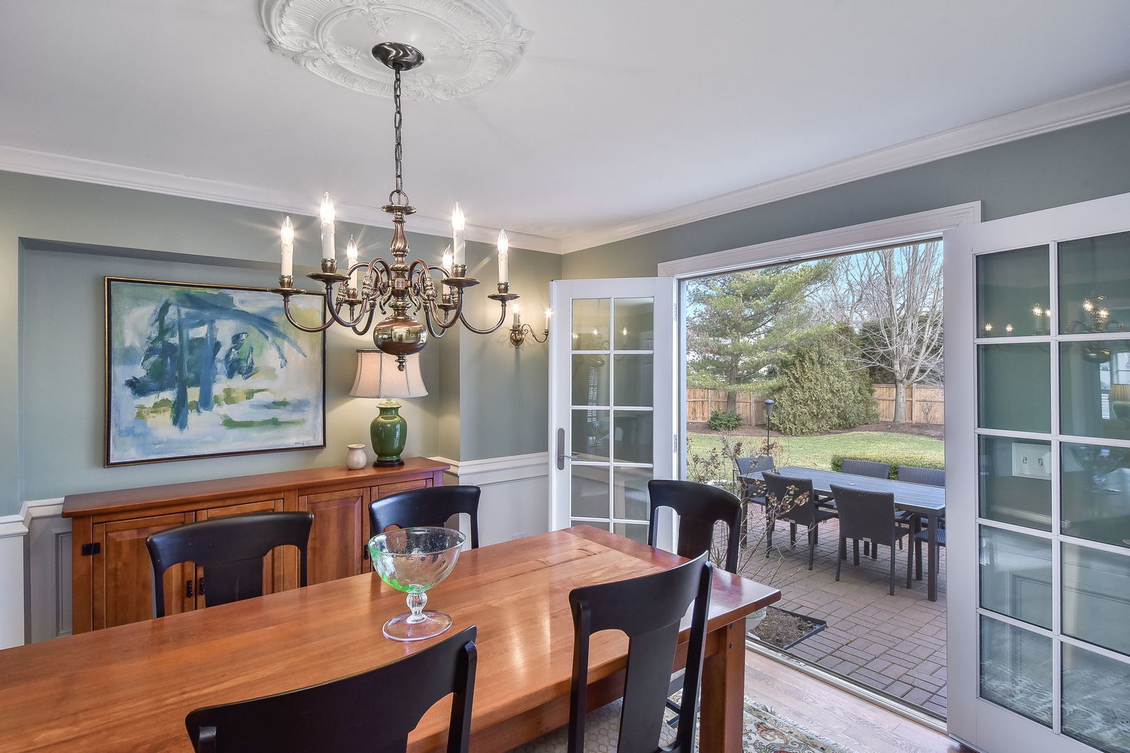 1211 Sunset Road Geneva, IL 60134 - Photo 14 of 65 a view of a dining room with furniture large windows and wooden floor