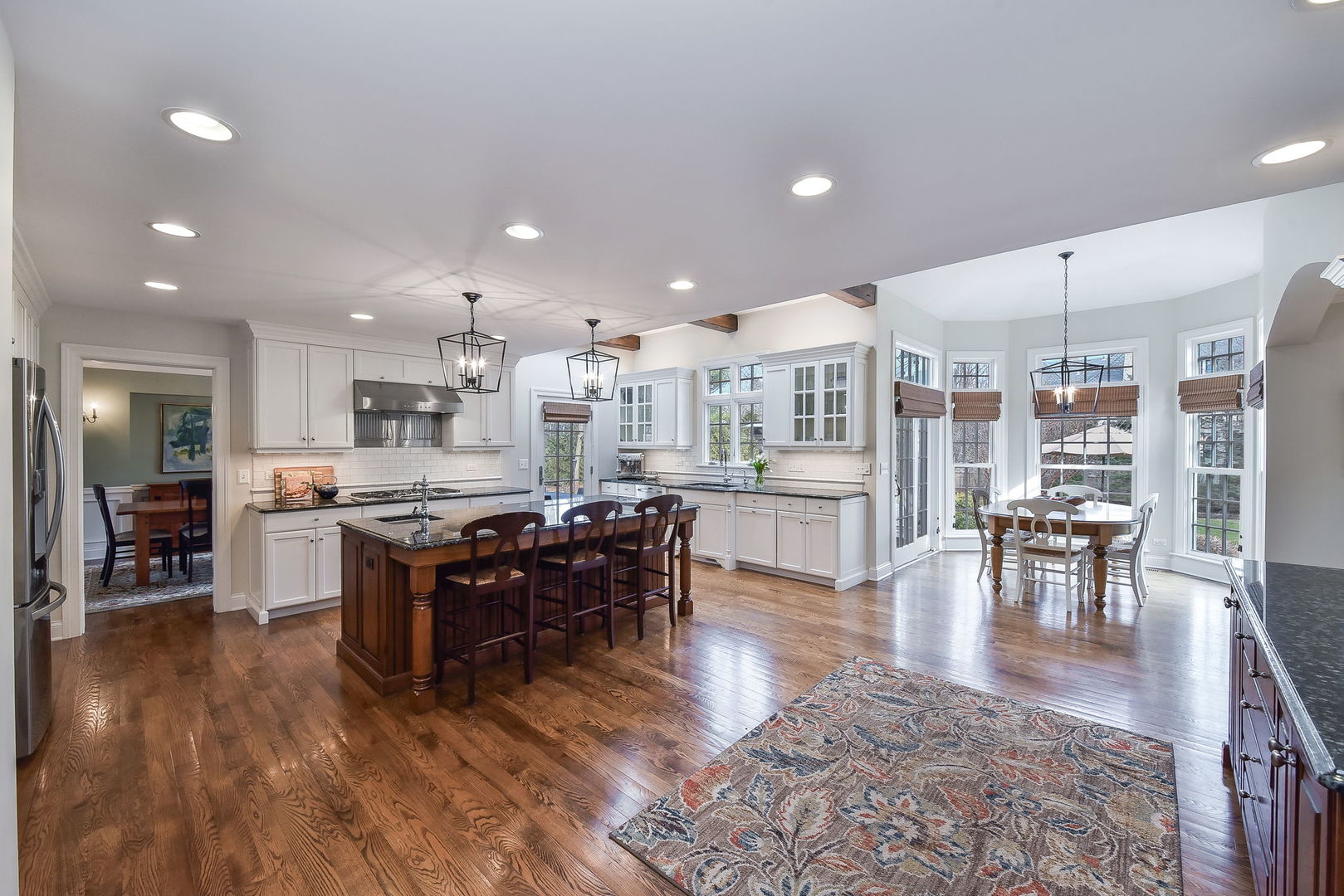 1211 Sunset Road Geneva, IL 60134 - Photo 17 of 65 a living room with stainless steel appliances furniture wooden floor and a kitchen view