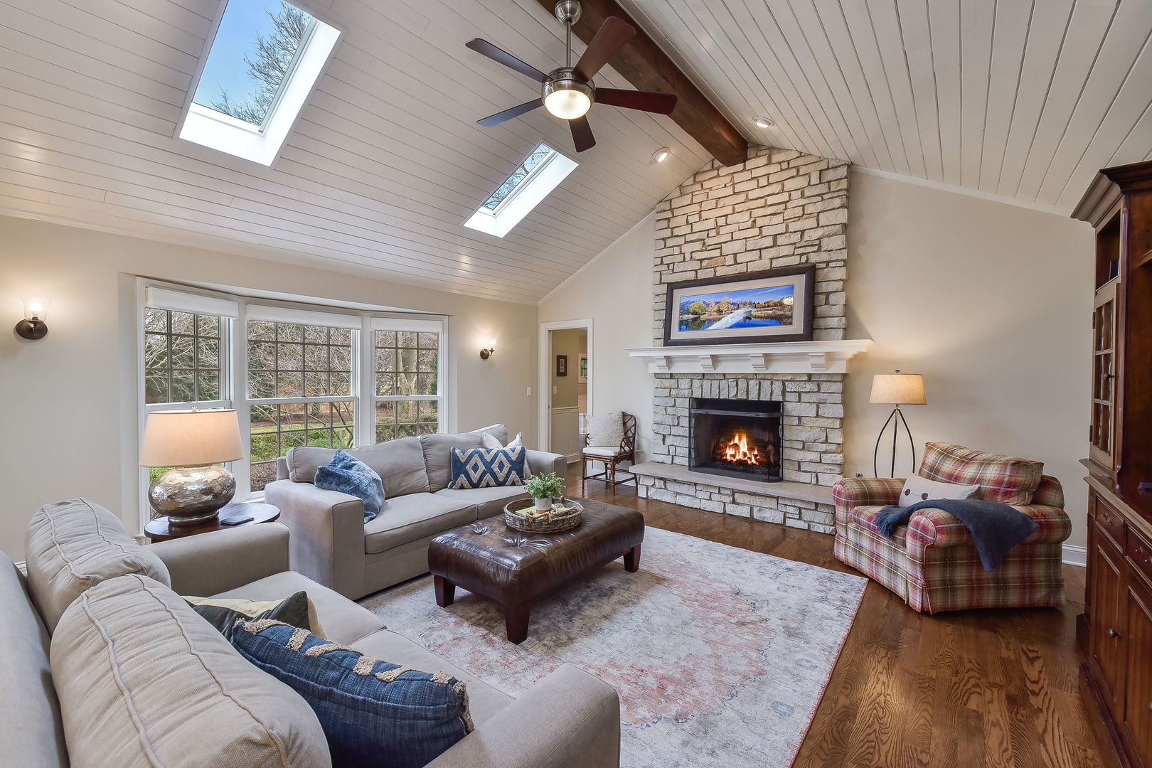 1211 Sunset Road Geneva, IL 60134 - Photo 22 of 65 a living room with furniture large window and a fireplace