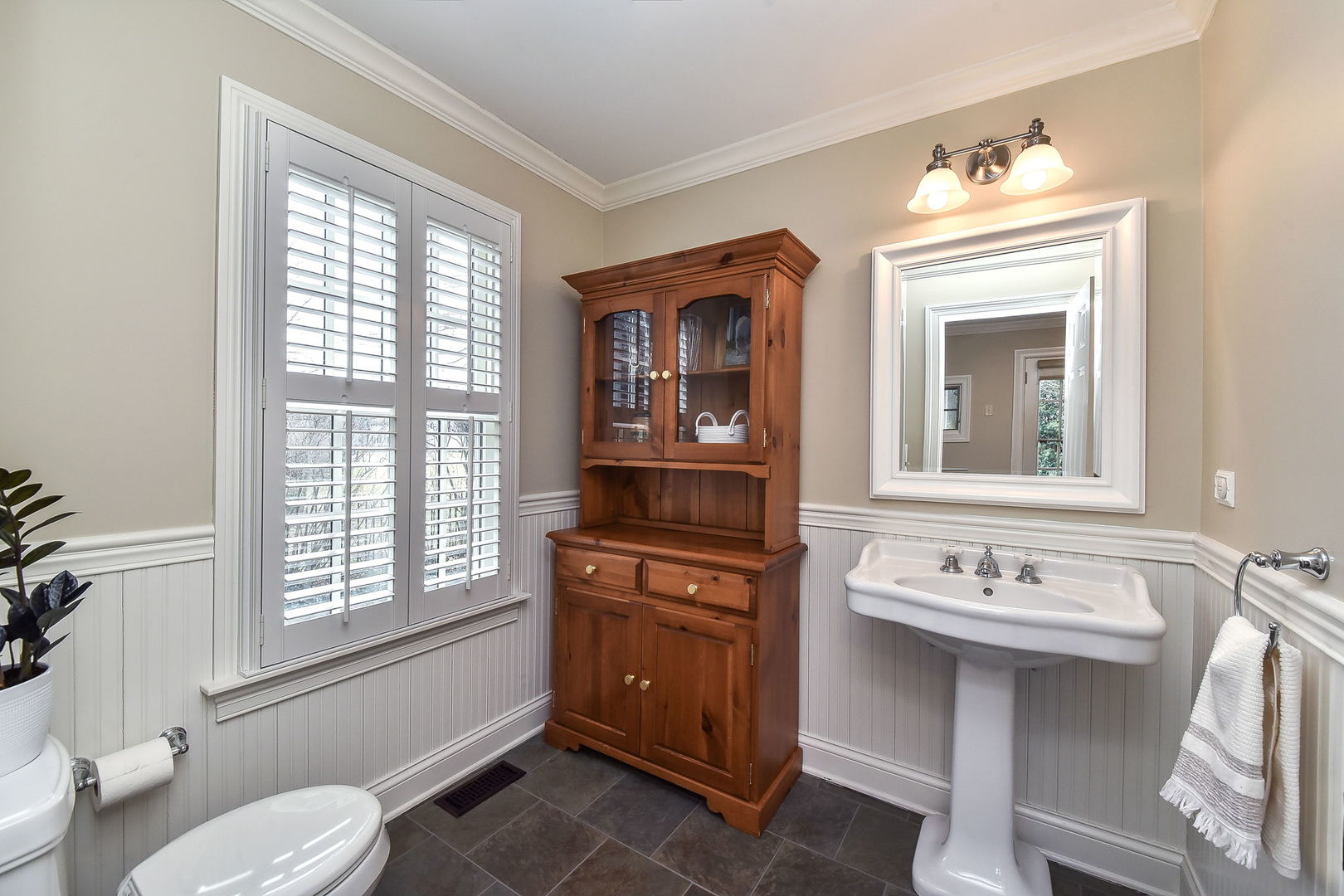 1211 Sunset Road Geneva, IL 60134 - Photo 28 of 65 a bathroom with a sink a toilet and a mirror