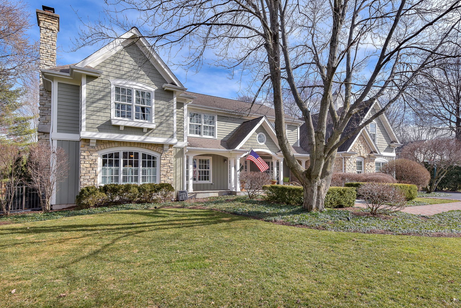 1211 Sunset Road Geneva, IL 60134 - Photo 3 of 65 a front view of a house with a yard