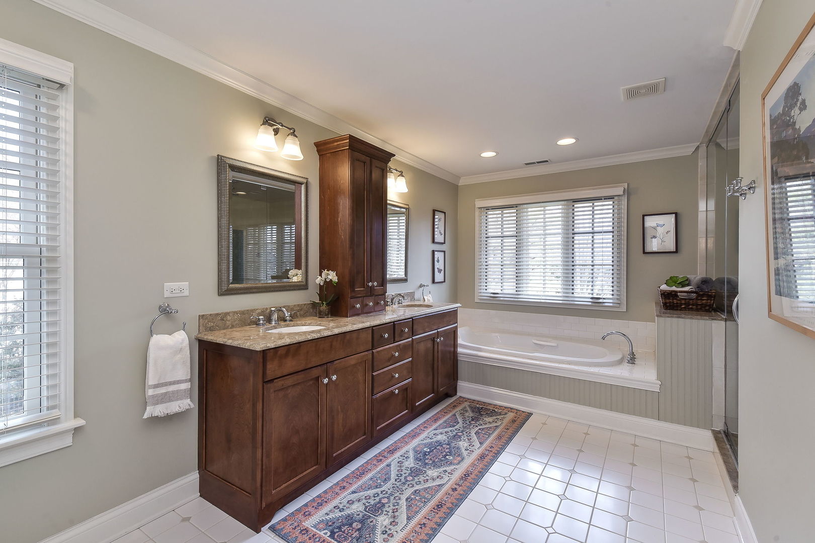 1211 Sunset Road Geneva, IL 60134 - Photo 34 of 65 a spacious bathroom with a tub sink shower and mirror