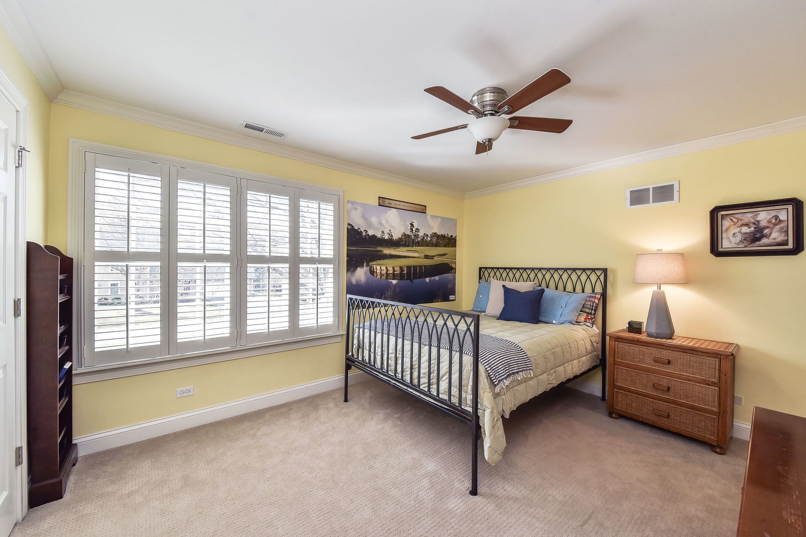 1211 Sunset Road Geneva, IL 60134 - Photo 38 of 65 a spacious bedroom with a bed and a chandelier