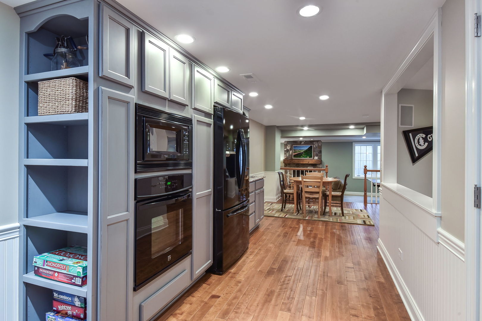 1211 Sunset Road Geneva, IL 60134 - Photo 45 of 65 a kitchen with stainless steel appliances granite countertop a refrigerator and a stove top oven with wooden floor
