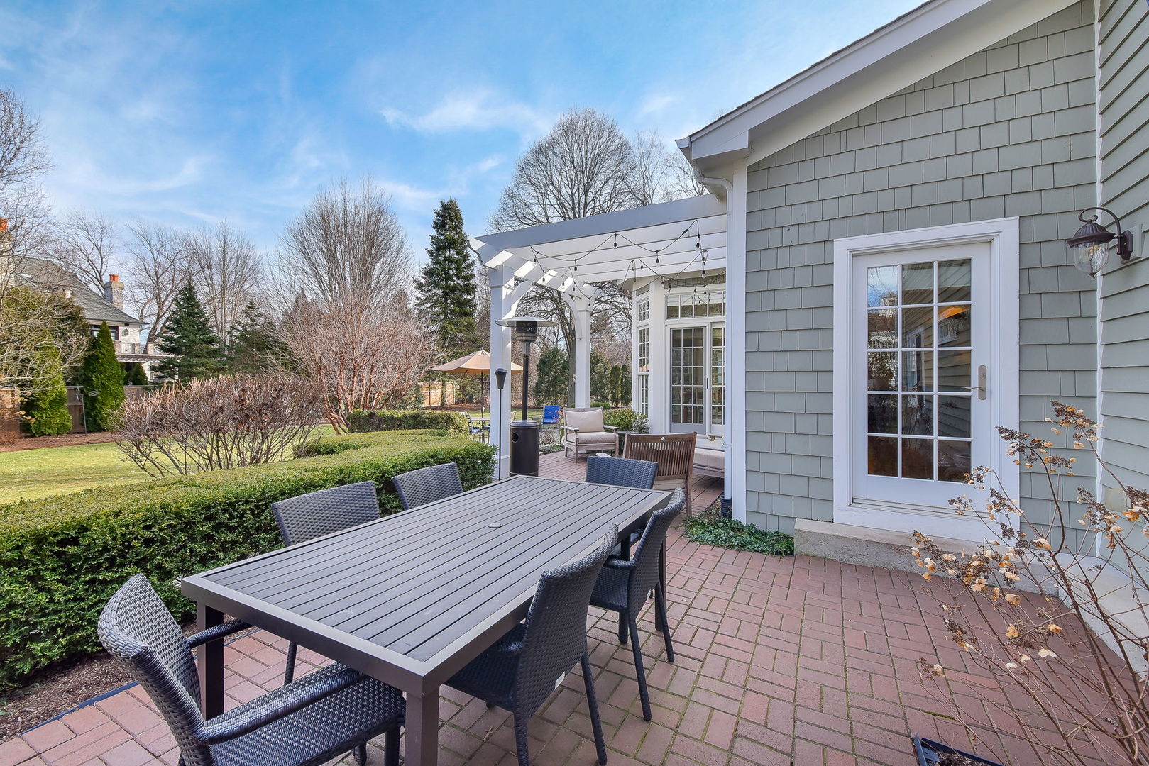 1211 Sunset Road Geneva, IL 60134 - Photo 53 of 65 a view of a patio with table and chairs and potted plants