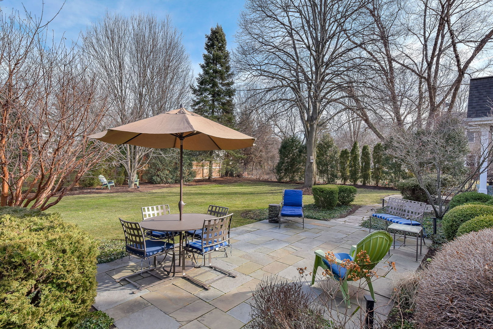 1211 Sunset Road Geneva, IL 60134 - Photo 55 of 65 a view of a table and chairs under an umbrella