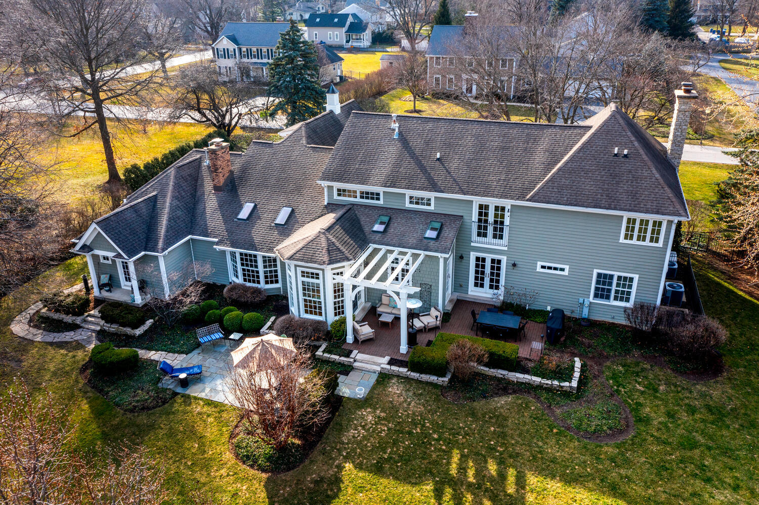 1211 Sunset Road Geneva, IL 60134 - Photo 61 of 65 a aerial view of a house with swimming pool lawn chairs and a yard