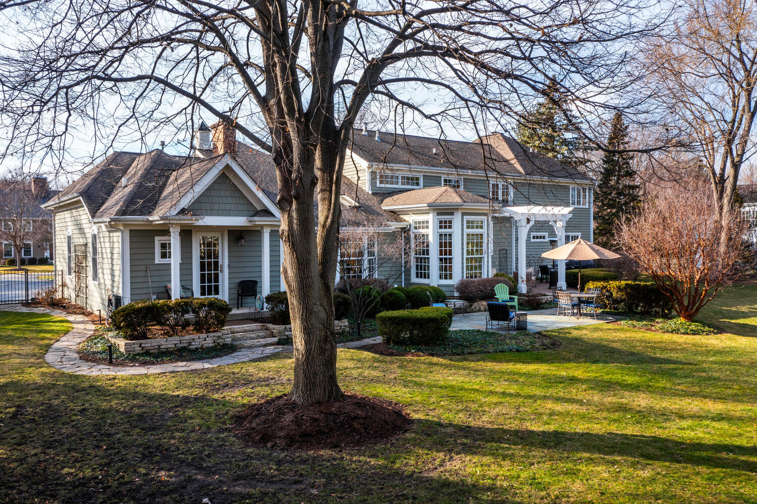 1211 Sunset Road Geneva, IL 60134 - Photo 62 of 65 a front view of a house with swimming pool and sitting area