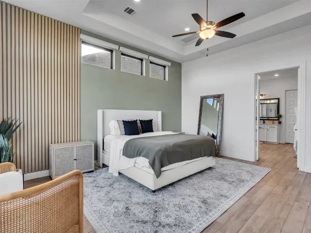 a large white kitchen with a sink and dish washer