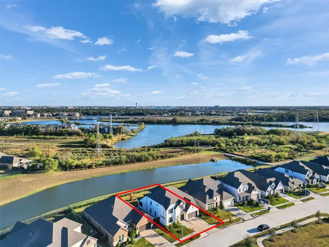 a view of a swimming pool with outdoor seating