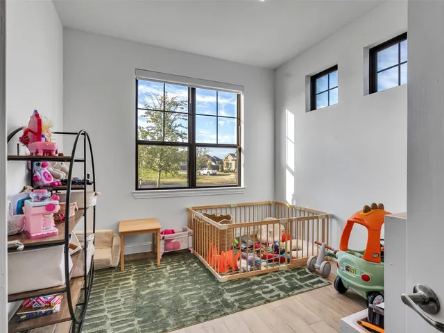 a bedroom with furniture and a window
