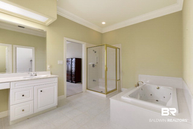 33168 River Road Orange Beach, AL 36561 - Photo 10 of 11 Master bath includes a large-scale walk-in closet, tub, shower and water closet.