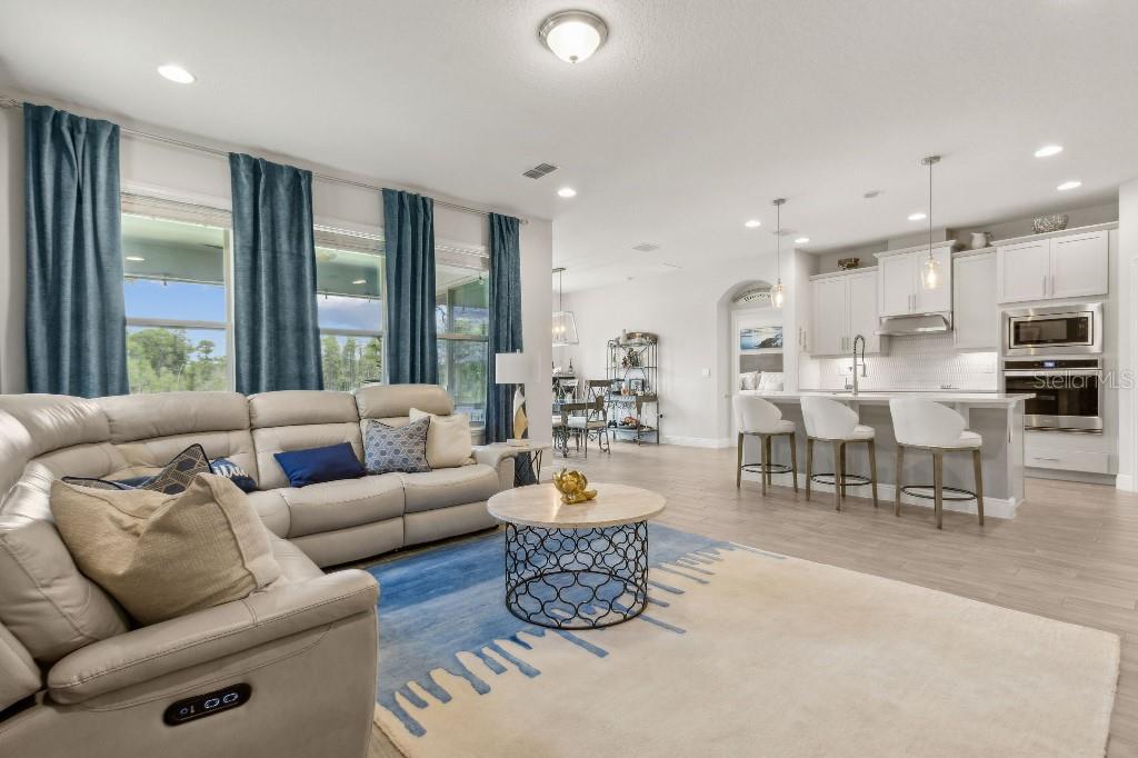 17936 Adrift Road Winter Garden, FL 34787 - Photo 12 of 44 a living room with furniture and a large window