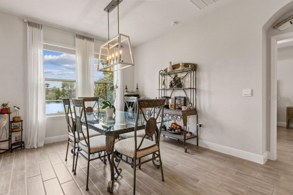 17936 Adrift Road Winter Garden, FL 34787 - Photo 16 of 44 a view of a dining room with furniture window and outside view