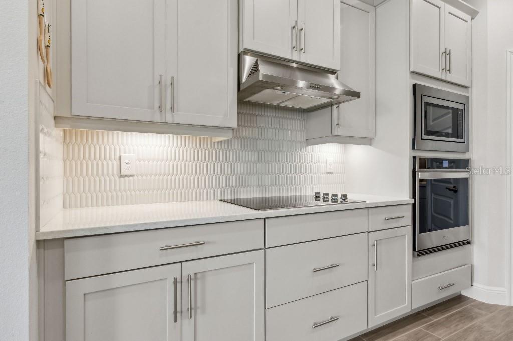 17936 Adrift Road Winter Garden, FL 34787 - Photo 17 of 44 a kitchen with appliances cabinets and a sink