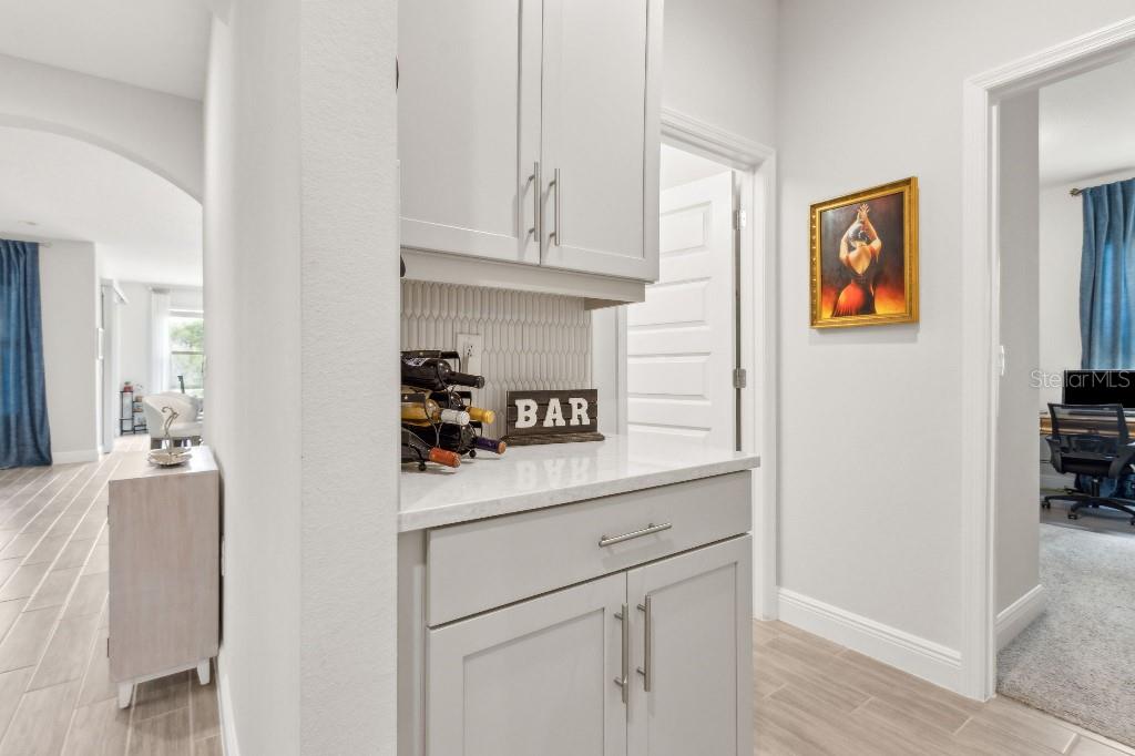 17936 Adrift Road Winter Garden, FL 34787 - Photo 18 of 44 a kitchen with stainless steel appliances cabinets and a window