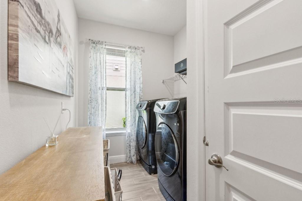 17936 Adrift Road Winter Garden, FL 34787 - Photo 19 of 44 a view of a storage & utility room with a washer dryer